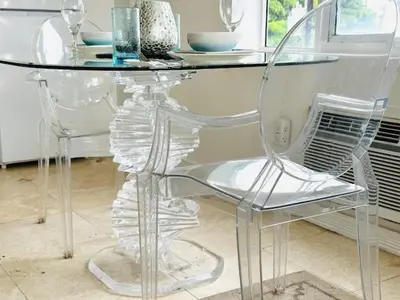 a glass table with two chairs and a table with wine glasses at South Beach Paradise Jr Suite next to Convention Center in Miami Beach