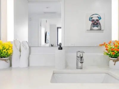 a white bathroom with a sink and a mirror at X Lounge VIII-Prime Corner Residence in Miami