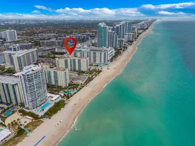 an aerial view of a beach with a red marker at Family-Friendly Beach Condo Steps to the Ocean- 9th floor in Hollywood Beach