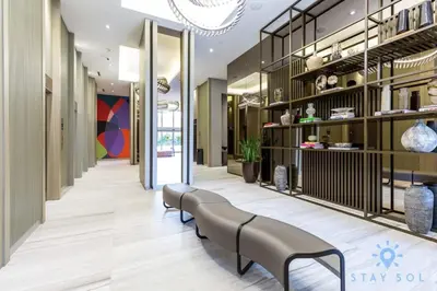 a lobby with a row of benches in a building at Oceanfront Escape with Resort-Style Amenities in Hollywood