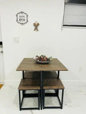 a table with a bowl of flowers on top of it at Lovely and Private Studio
