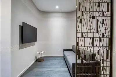a living room with a couch and a flat screen tv at SLS Lux Brickell Exclusive by Palermo Home Miami in Miami