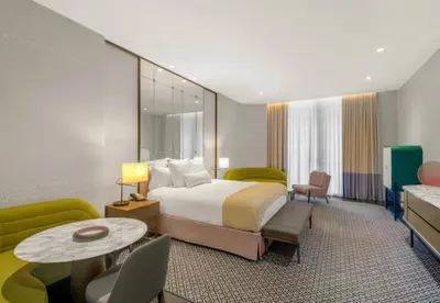 a hotel room with a bed and a table at SLS Lux Brickell Exclusive by Palermo Home Miami in Miami