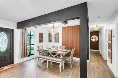 a dining room with a table and chairs at Prized by Florida |Private Pool and HotTub Oasis| in Fort Lauderdale