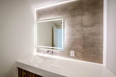 a bathroom with a sink and a mirror at Bayview Villa by Rove Travel - Waterfront with Patio in Miami Beach