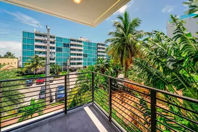 a balcony with a view of a city at Bayview Villa by Rove Travel - Waterfront with Patio in Miami Beach