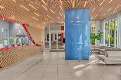 a lobby with a blue pillar in the middle of a room at Luxury Ocean View Penthouse 2501 Hallandale Beach in Hallandale Beach