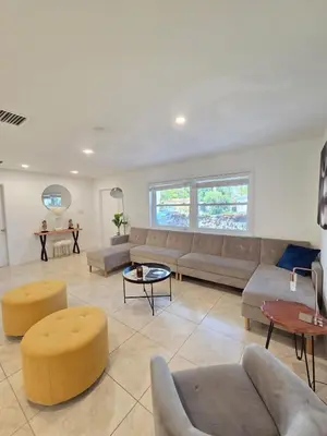a large living room with couches and tables at Modern Home in Hallandale Beach in Hallandale Beach