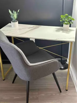 a desk with a chair and a table with two plants at Stylish 1BR Modern Apt in Brickell - Free Parking in Miami