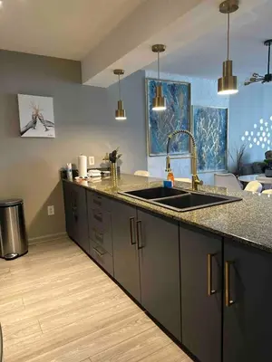 a kitchen with a sink and a counter top at Stylish 1BR Modern Apt in Brickell - Free Parking in Miami