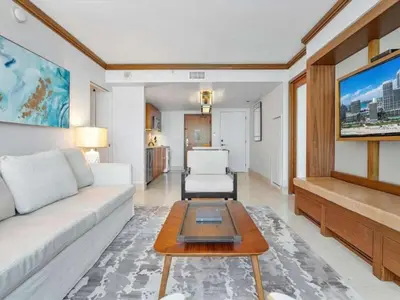a living room with a couch and a table at Villa Seafoam in Miami Beach