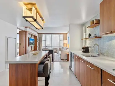 a kitchen with a sink and a counter top at Villa Seafoam in Miami Beach