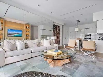 a living room with a couch and a table at Villa DecoBlu in Miami Beach