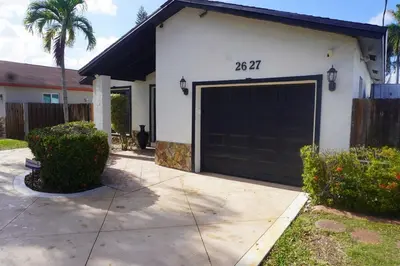 a garage with a black garage door on a house at Riverfront- Home in Hollywood