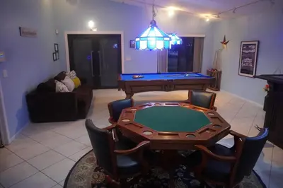 a living room with a ping pong table and a pool table at Riverfront- Home in Hollywood