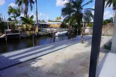 a view of a canal with a marina and palm trees at Riverfront- Home in Hollywood