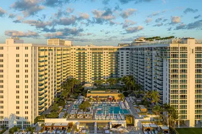 an aerial view of a resort with a pool and buildings at Villa Lumea in Miami Beach