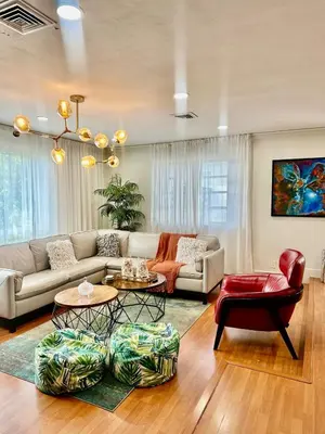 a living room with a couch and a table at The Hollywood Beach Experience in Hollywood