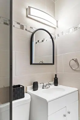 a bathroom with a sink and a mirror at Stylish 2BR/2BA Miami Home near Wynwood in Miami