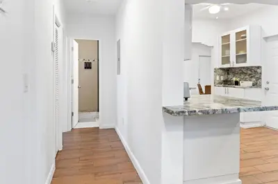 a kitchen with white walls and a counter top at Stylish 2BR/2BA Miami Home near Wynwood in Miami