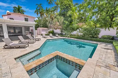 a swimming pool in the backyard of a house at Stunning Tropical Getaway Steps To The Beach with Pool in Hollywood
