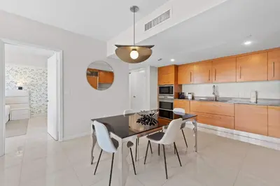 a kitchen with a dining room table and chairs at Luxury Waterfront Brickell ICON W-Hotel Balcony Water Views in Miami