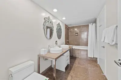 a bathroom with a sink and a toilet and a tub at Luxury Waterfront Brickell ICON W-Hotel Balcony Water Views in Miami