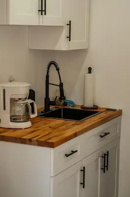 a kitchen counter top with a sink and aounter at Comfy and Relaxed in Cutler Bay