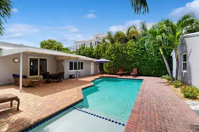 a swimming pool in the backyard of a house at The Front House in Fort Lauderdale