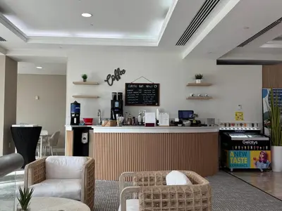 a coffee shop with a counter and chairs in a room at Sunrise on the Intracoastal in Fort Lauderdale