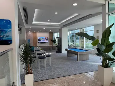 an office with a pool table in the middle at Sunrise on the Intracoastal in Fort Lauderdale