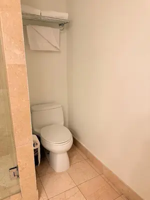 a bathroom with a white toilet in a room at Sunrise on the Intracoastal in Fort Lauderdale