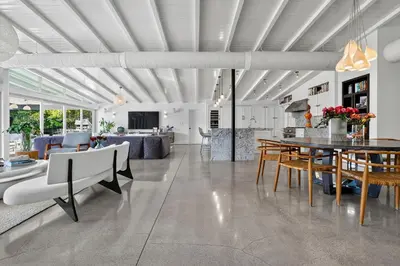 a kitchen and living room with a table and chairs at Isla Solana by Rove Travel - Waterfront with Pool in Miami