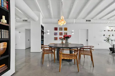 a dining room with a table and chairs at Isla Solana by Rove Travel - Waterfront with Pool in Miami