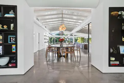 a dining room with a table and chairs at Isla Solana by Rove Travel - Waterfront with Pool in Miami