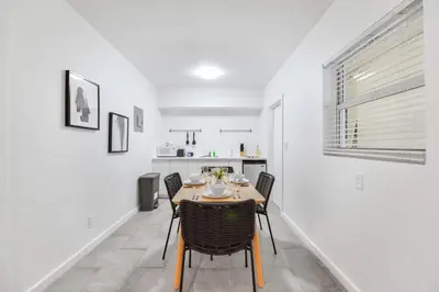 a dining room with a table and chairs at Modern Studio Retreat to Explore Miami in Miami