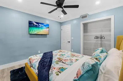 a bedroom with a bed and a ceiling fan at RJ Home Away From Home LLC in Miami Gardens