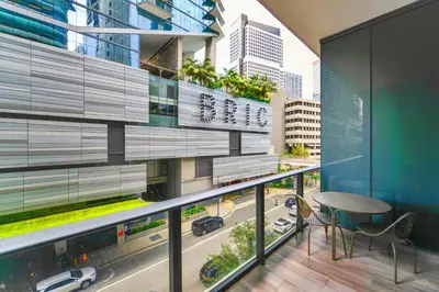 a balcony with a table and a view of a city at GREAT STUDIO - Luxe Brickell Stay Near Bay in Miami