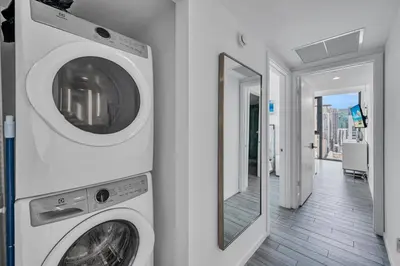 a washer and dryer in a room with a mirror at Miami City Lights 2BR 2BA in Miami