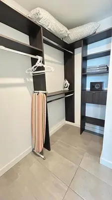 a bedroom with a bunk bed and a closet at Contemporary Comfort Rooftop Views & Full Kitchen in Miami