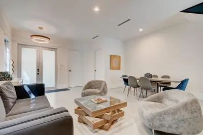 a living room with a couch and chairs and a table at Lux Villa Sol in Miami
