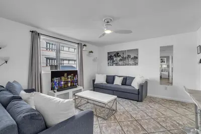 a living room with a couch and a table at 1 BLOCK FROM OCEAN 1 Bedroom in South Beach Collins Avenue in Miami Beach