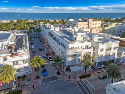 an aerial view of a city with palm trees and the ocean at 1 BLOCK FROM OCEAN 1 Bedroom in South Beach Collins Avenue in Miami Beach