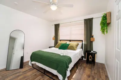 a bedroom with a bed and a ceiling fan at Family Home Casa Del Rio - Unit A in Miami