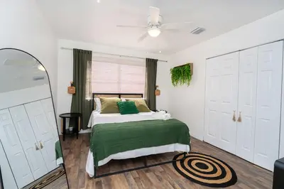 a bedroom with a bed and a ceiling fan at Family Home Casa Del Rio - Unit A in Miami