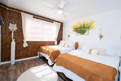 a bedroom with two beds and a window at Family Home Casa Del Rio - Unit A in Miami