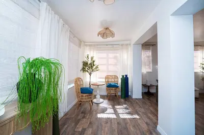 a living room with a table and chairs at Family Home Casa Del Rio - Unit A in Miami