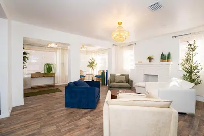 a living room with white furniture and a fireplace at Family Home Casa Del Rio - Unit A in Miami