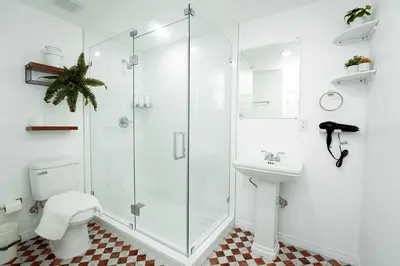 a bathroom with a shower and a toilet and a sink at Rio retreat - Unit B in Miami