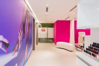 a dressing room with pink and purple walls at Luxe Bayview Condo w Sauna, Hot tub & Beach Access in Fort Lauderdale